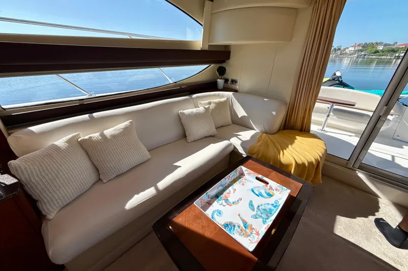 Slide: The Image of Luxurious interior of 2009 Meridian 391 Sedan yacht with cozy seating and waterfront view. - 30