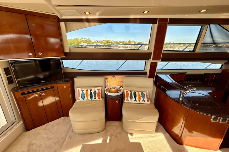 Slide: The Image of Luxurious 2009 Meridian 391 Sedan interior with plush seating, TV, and scenic windows. - 32