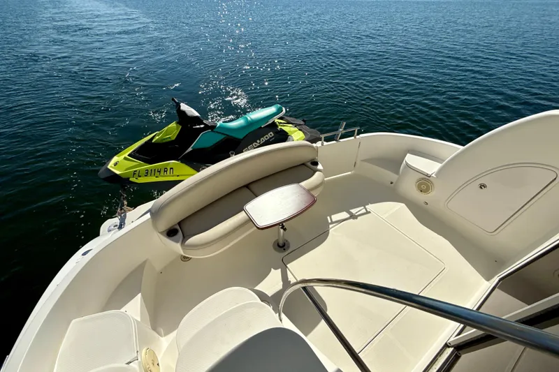 Slide: The Image of 2009 Meridian 391 Sedan yacht with Sea-Doo jet ski on calm water. - 37