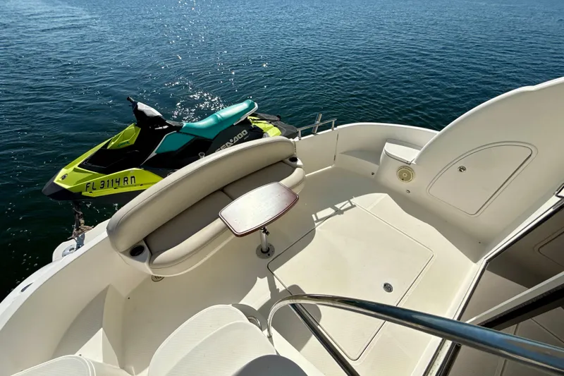 Slide: The Image of 2009 Meridian 391 Sedan yacht deck with Sea-Doo jet ski on water. - 38