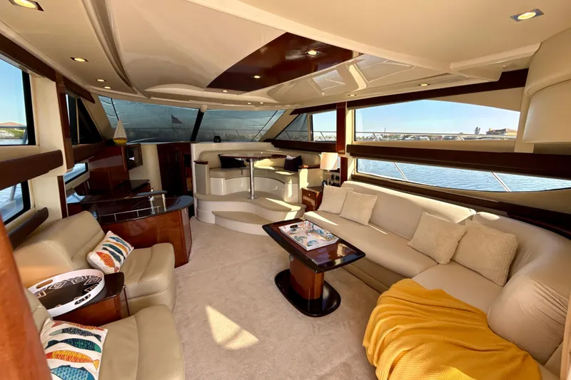 Slide: The Image of Luxurious interior of a 2009 Meridian 391 Sedan yacht with elegant seating and panoramic windows. - 4