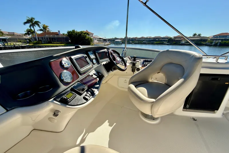 Slide: The Image of 2009 Meridian 391 Sedan helm with luxurious seating and advanced navigation controls. - 42