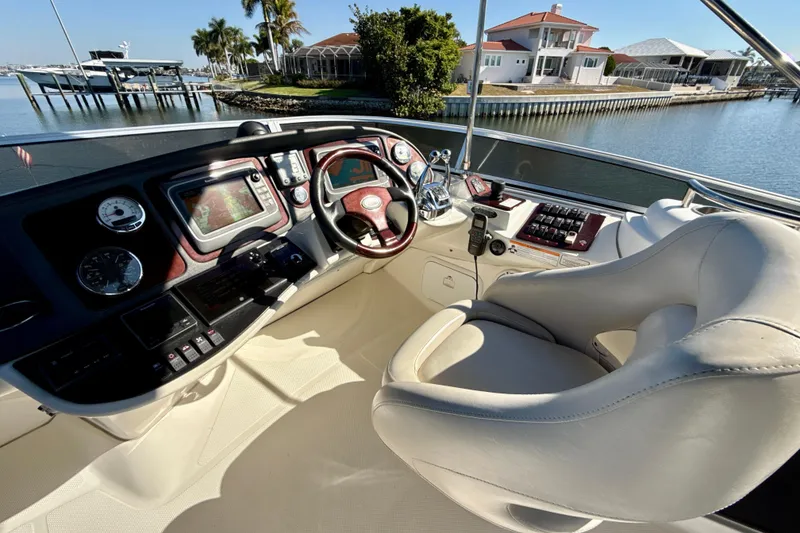 Slide: The Image of 2009 Meridian 391 Sedan helm with modern controls and waterfront view. - 43