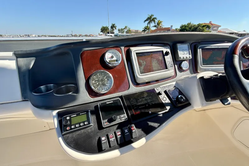 Slide: The Image of 2009 Meridian 391 Sedan dashboard with navigation and control instruments. - 44