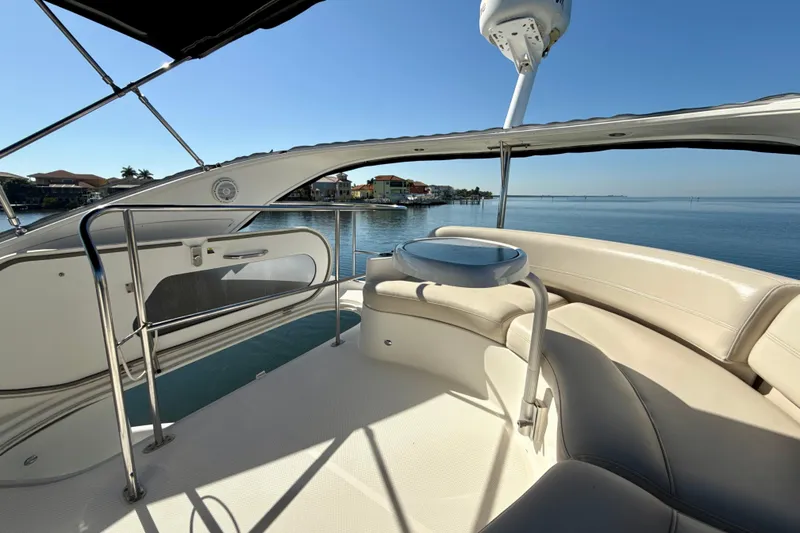 Slide: The Image of 2009 Meridian 391 Sedan yacht interior with waterfront view and seating area. - 49