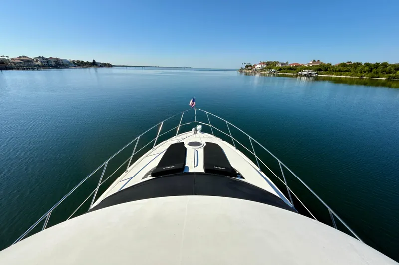 Slide: The Image of 2009 Meridian 391 Sedan yacht cruising on a calm, scenic waterway. - 52