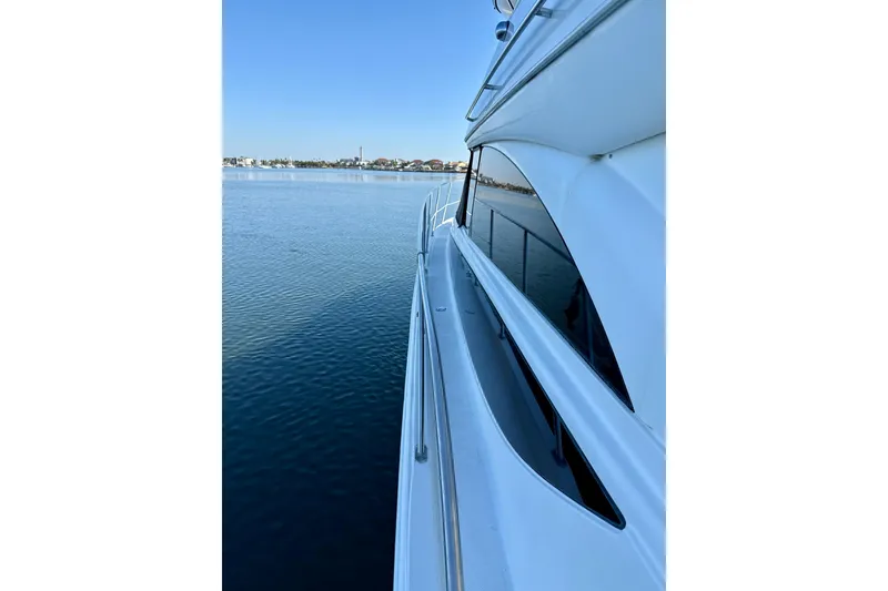 Slide: The Image of 2009 Meridian 391 Sedan yacht on calm water, side view. - 54