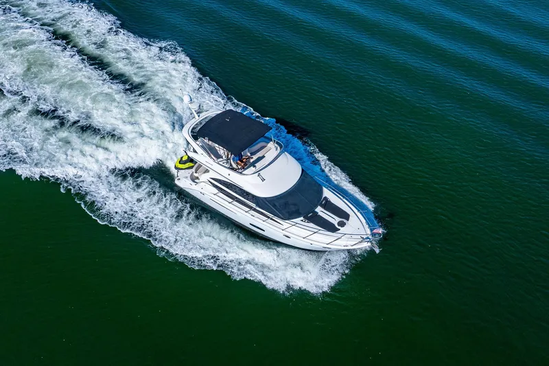 Slide: The Image of 2009 Meridian 391 Sedan cruising on open water, aerial view. - 61