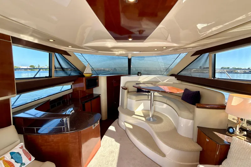 Slide: The Image of Luxurious interior of a 2009 Meridian 391 Sedan yacht with elegant seating and panoramic windows. - 9