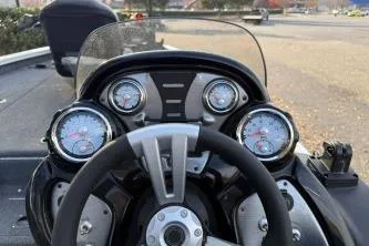 Slide: The Image of 2021 Tracker Pro Team 190 TX Tournament Edition boat dashboard with gauges and steering wheel. - 3