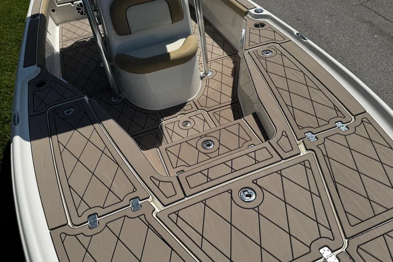 Slide: The Image of 2019 Key West 230 Bay Reef boat deck with tan diamond-patterned flooring and seating. - 108