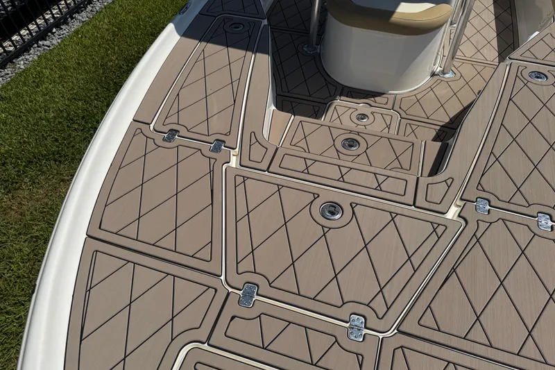 Slide: The Image of 2019 Key West 230 Bay Reef boat deck with tan diamond-patterned flooring. - 109