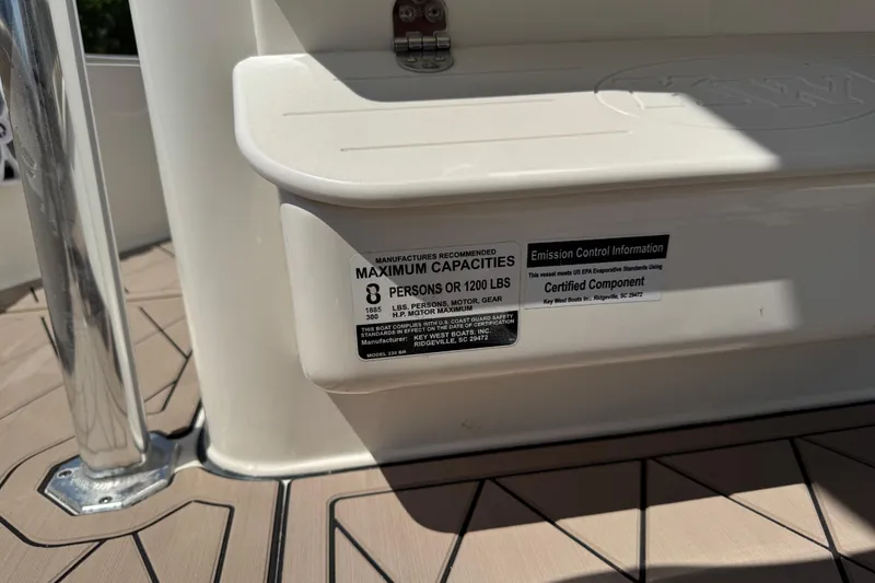 Slide: The Image of 2019 Key West 230 Bay Reef capacity label, showing maximum of 8 persons or 1200 lbs. - 118