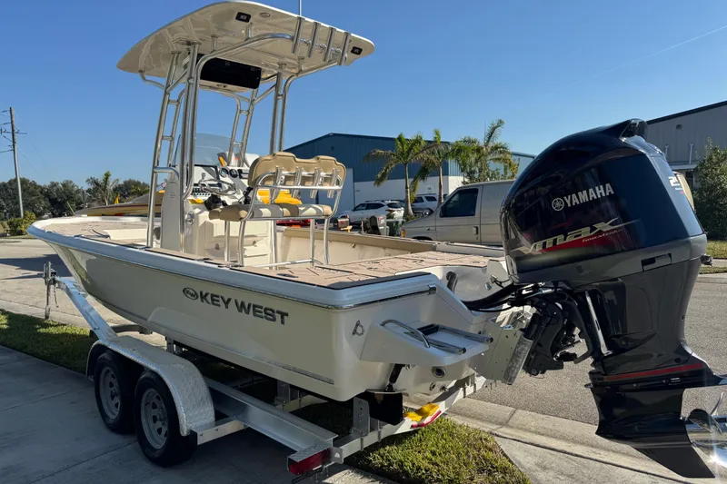 Slide: The Image of 2019 Key West 230 Bay Reef boat with Yamaha engine on trailer. - 12