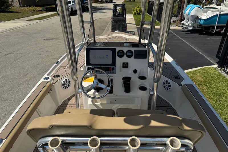 Slide: The Image of 2019 Key West 230 Bay Reef boat interior with Garmin navigation system and steering wheel. - 120