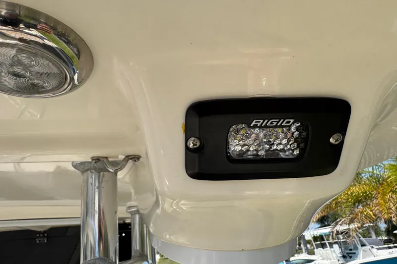 Slide: The Image of LED light fixture on 2019 Key West 230 Bay Reef boat, featuring Rigid branding. - 122