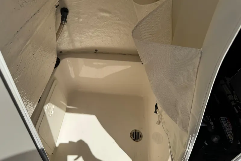 Slide: The Image of Interior compartment of a 2019 Key West 230 Bay Reef boat, featuring storage space. - 125