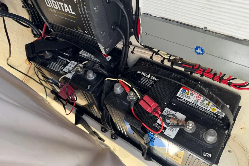 Slide: The Image of Battery setup in a 2019 Key West 230 Bay Reef boat, featuring wiring and connections. - 126