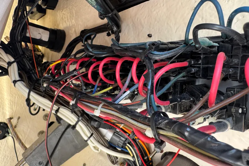 Slide: The Image of Electrical wiring inside a 2019 Key West 230 Bay Reef boat, showcasing complex cable arrangement. - 127