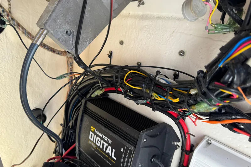 Slide: The Image of Electrical wiring and Minn Kota digital charger inside a 2019 Key West 230 Bay Reef boat. - 128