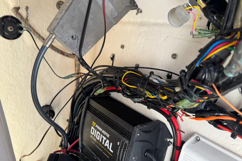 Slide: The Image of Electrical wiring and Minn Kota digital charger inside a 2019 Key West 230 Bay Reef boat. - 130