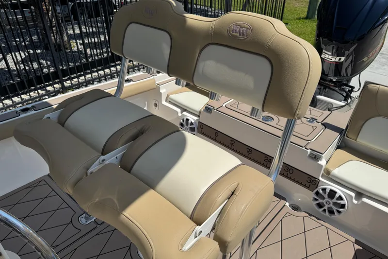Slide: The Image of 2019 Key West 230 Bay Reef boat interior with beige seating and Yamaha 250 engine. - 132