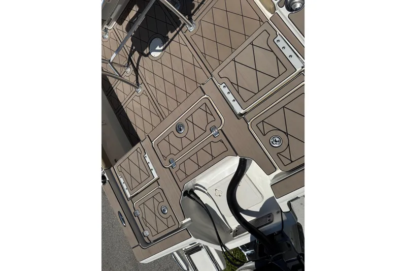 Slide: The Image of 2019 Key West 230 Bay Reef boat deck with storage compartments and textured flooring. - 135