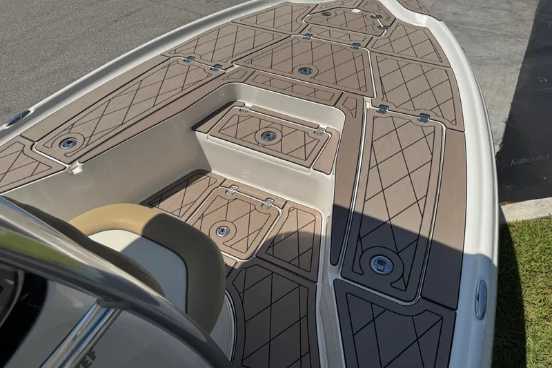 Slide: The Image of 2019 Key West 230 Bay Reef boat deck with tan diamond-patterned flooring. - 139