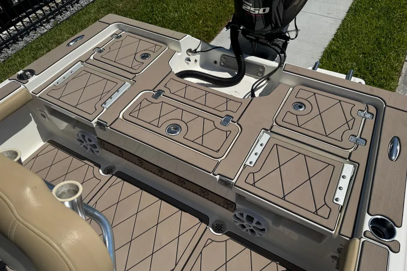 Slide: The Image of 2019 Key West 230 Bay Reef boat deck with storage compartments and Yamaha 250 engine. - 143