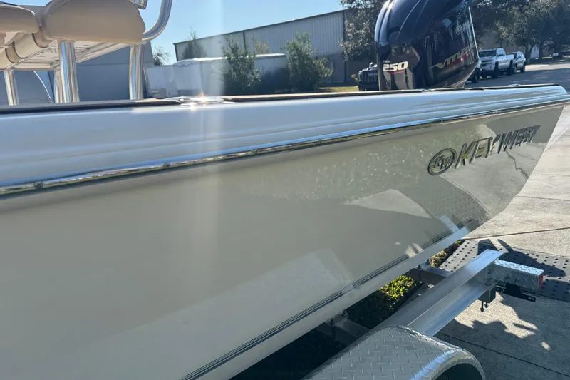 Slide: The Image of 2019 Key West 230 Bay Reef boat on trailer, featuring Yamaha 250 engine. - 20