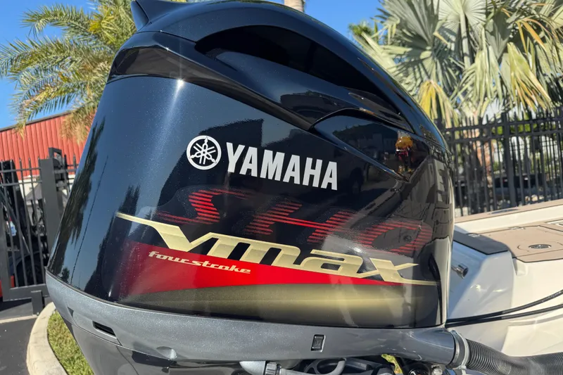 Slide: The Image of Yamaha VMAX outboard motor on 2019 Key West 230 Bay Reef boat, palm trees in background. - 25