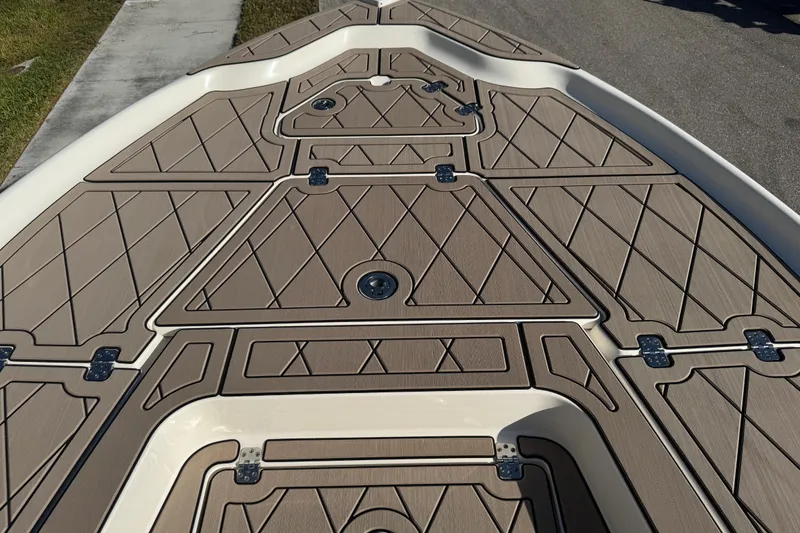 Slide: The Image of 2019 Key West 230 Bay Reef boat deck with tan diamond-patterned design. - 36