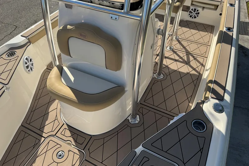 Slide: The Image of 2019 Key West 230 Bay Reef boat interior with cushioned seating and non-slip flooring. - 43