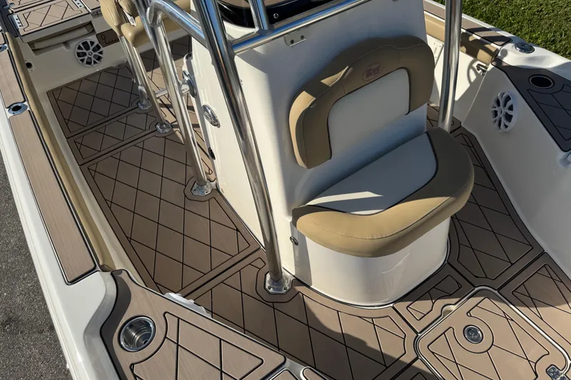 Slide: The Image of 2019 Key West 230 Bay Reef boat interior with cushioned seating and non-slip flooring. - 44