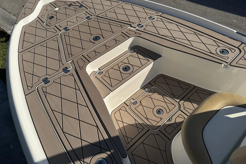 Slide: The Image of 2019 Key West 230 Bay Reef boat deck with tan diamond-patterned flooring. - 45