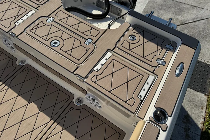 Slide: The Image of 2019 Key West 230 Bay Reef boat deck with storage compartments and sleek design. - 48