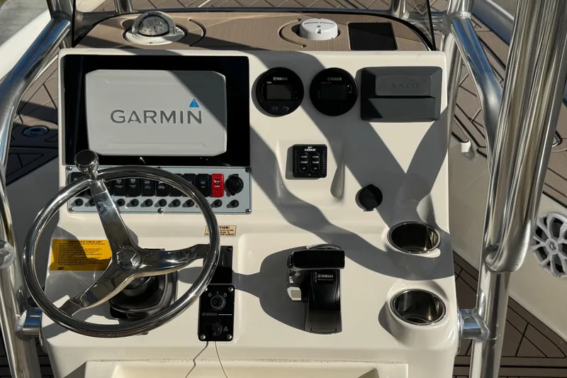 Slide: The Image of 2019 Key West 230 Bay Reef boat console with Garmin display and steering wheel. - 50