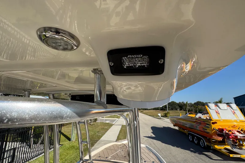 Slide: The Image of 2019 Key West 230 Bay Reef boat with Rigid LED light and polished metal railings. - 57