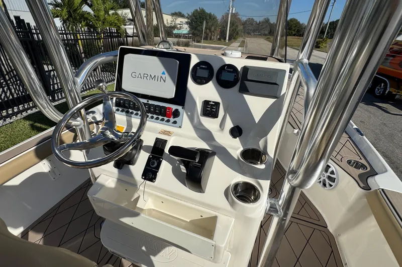 Slide: The Image of 2019 Key West 230 Bay Reef boat console with Garmin navigation system and steering wheel. - 58