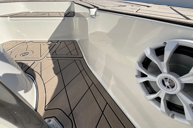 Slide: The Image of 2019 Key West 230 Bay Reef boat interior with speaker and deck details. - 60