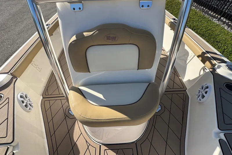 Slide: The Image of 2019 Key West 230 Bay Reef boat seat with tan and white upholstery. - 62