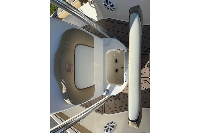 Slide: The Image of 2019 Key West 230 Bay Reef boat interior with seating and storage compartment. - 63