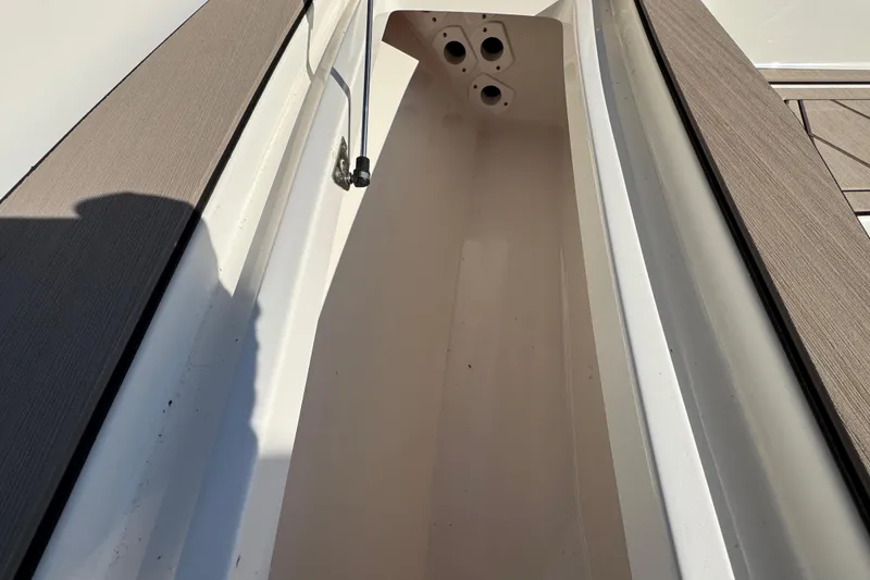 Slide: The Image of 2019 Key West 230 Bay Reef boat storage compartment with rod holders. - 69