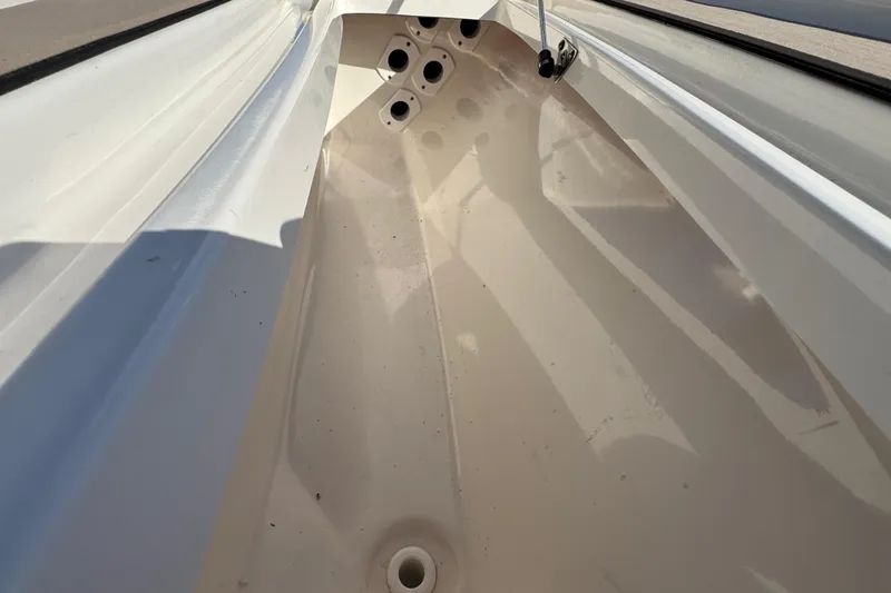 Slide: The Image of Interior view of a 2019 Key West 230 Bay Reef boat, showcasing storage compartment. - 72