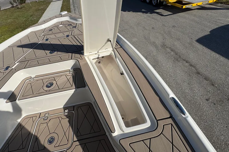 Slide: The Image of 2019 Key West 230 Bay Reef boat with open storage compartment on deck. - 75
