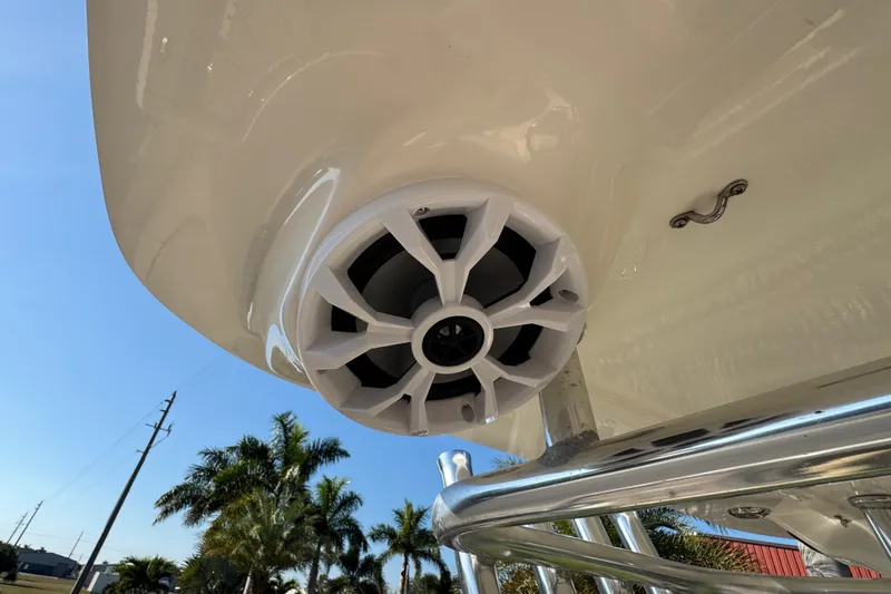 Slide: The Image of 2019 Key West 230 Bay Reef boat speaker and railing under clear sky. - 82