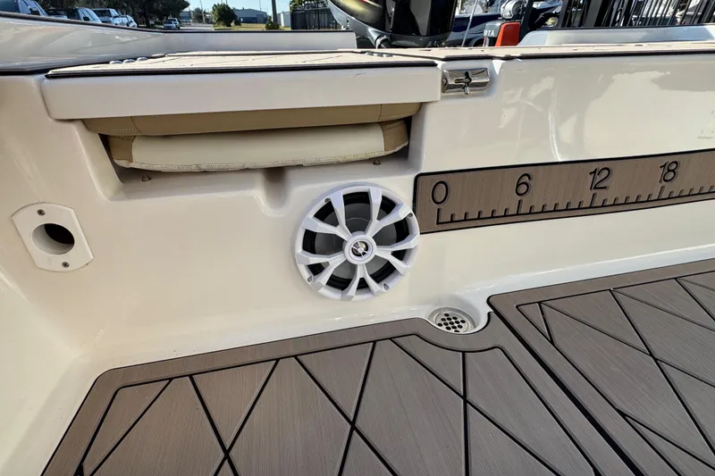 Slide: The Image of 2019 Key West 230 Bay Reef boat interior with speaker and measuring ruler. - 83