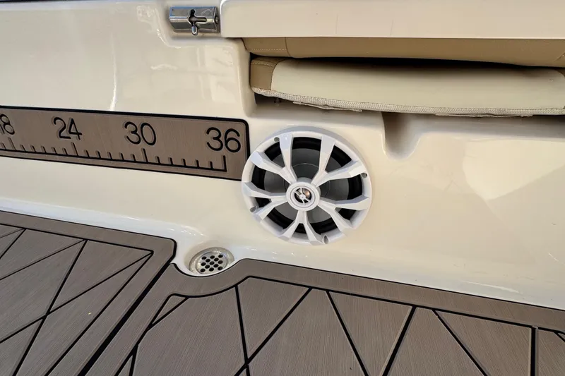 Slide: The Image of 2019 Key West 230 Bay Reef boat interior with speaker and measurement scale. - 84