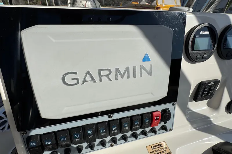 Slide: The Image of Garmin navigation system on 2019 Key West 230 Bay Reef boat dashboard. - 86