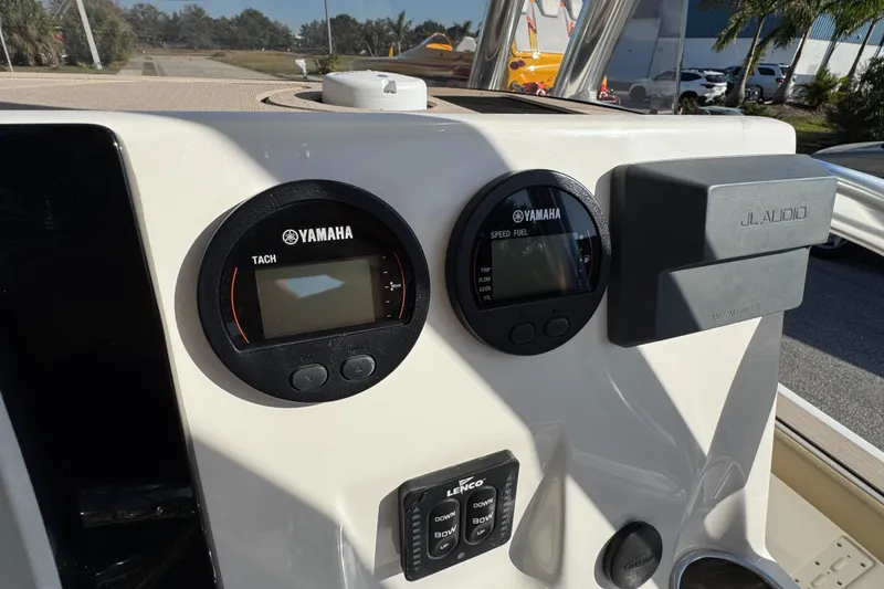 Slide: The Image of Dashboard of 2019 Key West 230 Bay Reef with Yamaha gauges and JL Audio system. - 87